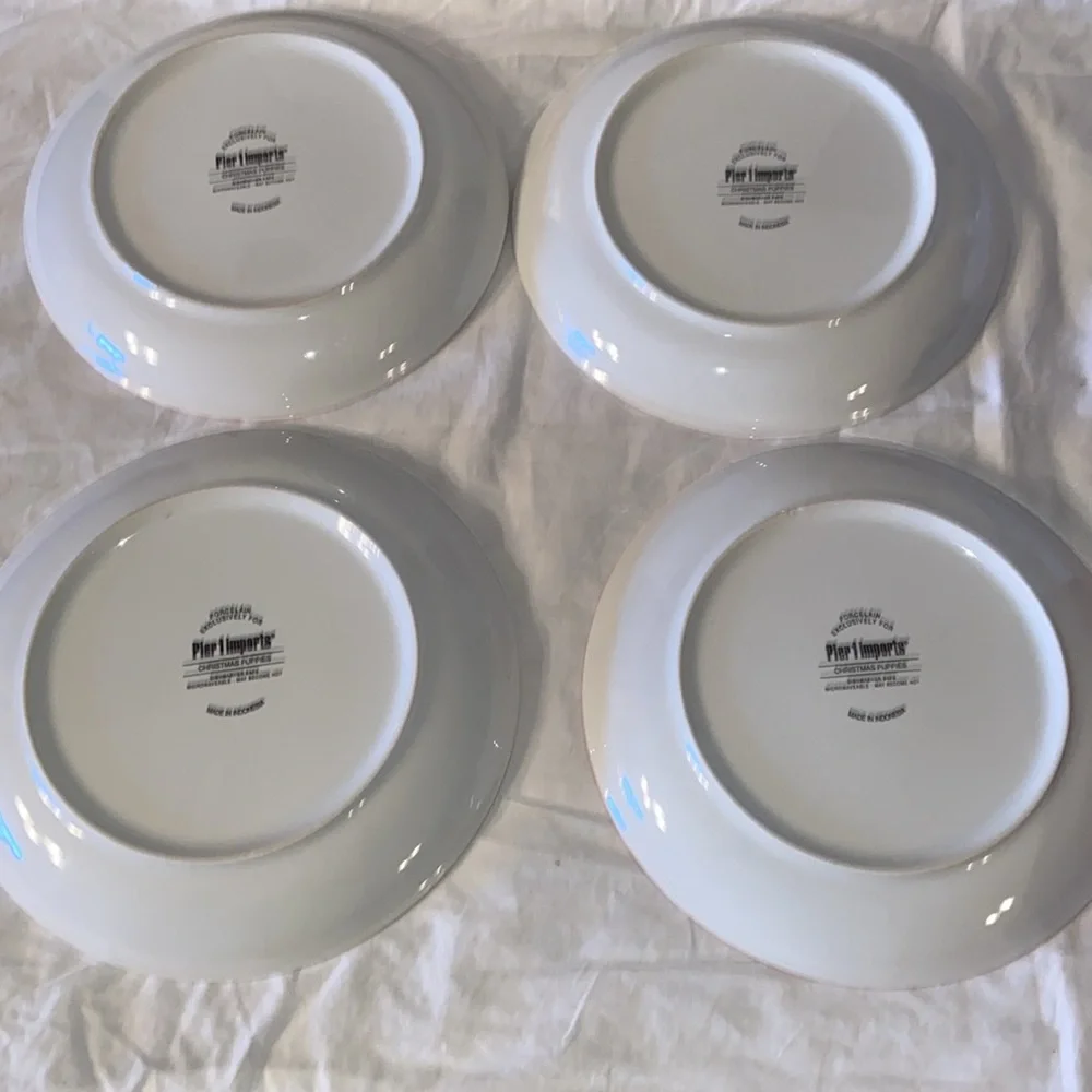 New in box Pier 1 Holiday Christmas dogs set of 4 salad plates.
